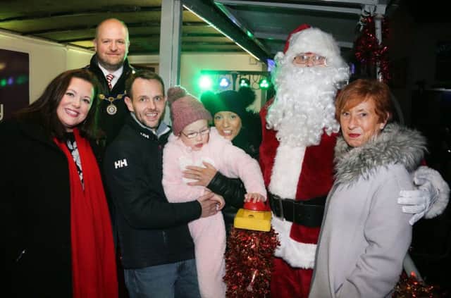 Santa pictured with Aalivah Aron and Kim Cochrane with Winnie Mellot from Chamber of commerce Kerry McLean fron BBC Radio Ulster and Deputy Mayor Cllr Trevor Clarke at the switch on. Aalivah 11 switched the lights on !