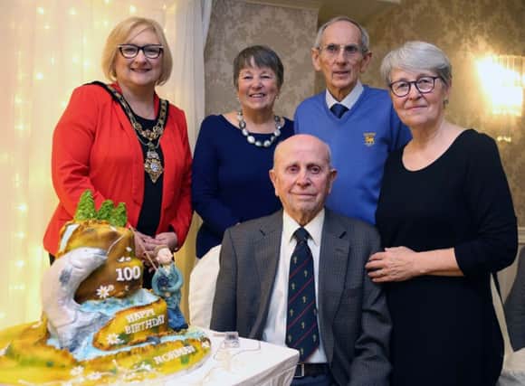 The Mayor of Causeway Coast and Glens Borough Council Councillor Brenda Chivers wishes a very happy birthday to 100-year-old Norman Irwin at his surprise party held in the Bushtown Hotel Coleraine on Saturday afternoon.Included are Normas Family David, Joy and Elizabeth.PICTURE KEVIN MCAULEY/MCAULEY MULTIMEDIA