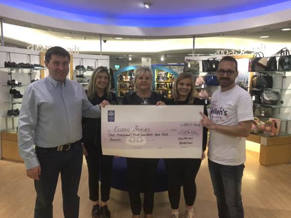 Peter McVeigh (pictured left) of Donaghys, Banbridge presents a cheque for the money raised at the recent Ladies Night held in aid of Ellens Journey. Attendees were treated to an in-store fashion show with giveaways and raffle prizes on the night, as well as Donaghys store and online discount. Also pictured are Beth McDaniel (Sales Assistant) Sheila Barry (General Manager) Chloe Gibson (Sales Assistant) and Paddy Treanor (Ellens Father).