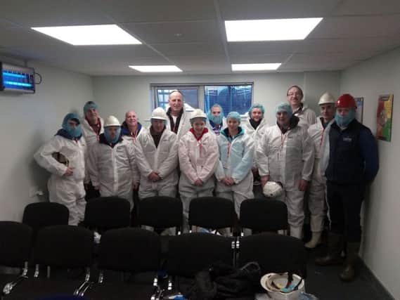Group members, with protective clothing, prior to the visit with Senan White (back right) and Keith Williamson (front right).