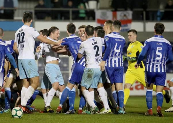 Newry and Ballymena players get a bit heated after a challenge