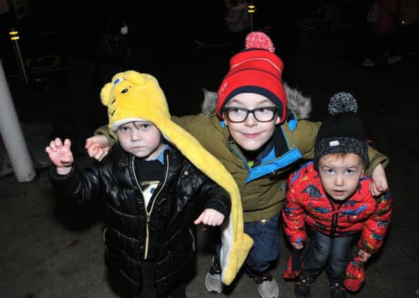 The Goodall boys,Arnie, Jack and Noah watching for Santa to arrive in Larne. INLT 47-220-AM