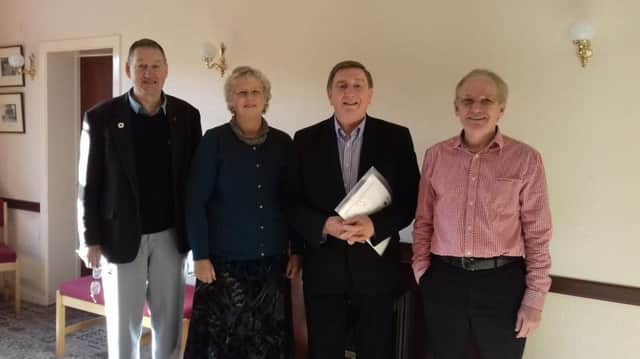 Fr Brian D'Arcy with members of Causeway Coast Peace Group.
