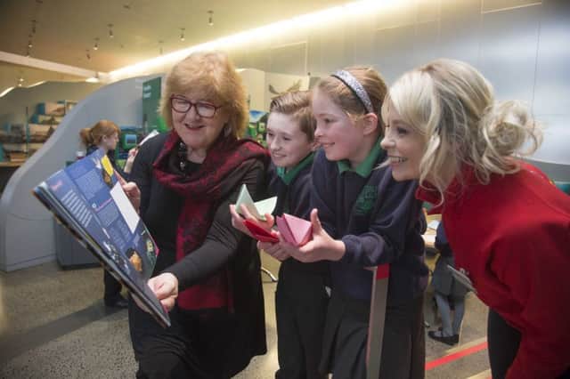 Pupils from Dunseverick Primary School join local children's writer Liz Weir and Jennifer Michael from the National Trust to get the first look at the new 32 page childrenÃ¢Â¬"s guidebook.