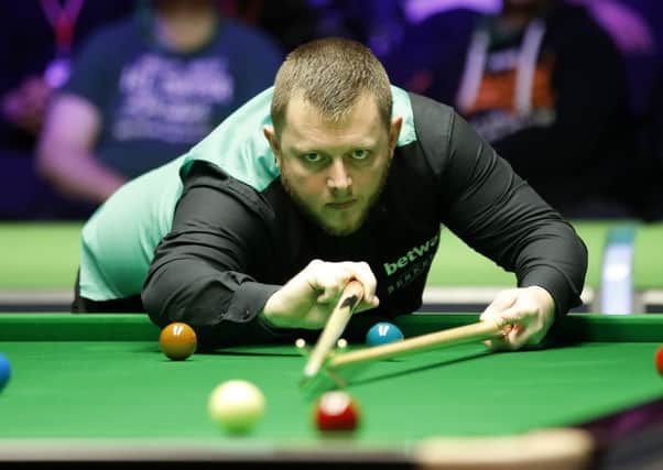 Mark Allen in action against Hossein Vafaei during day eight of the Betway UK Championship.