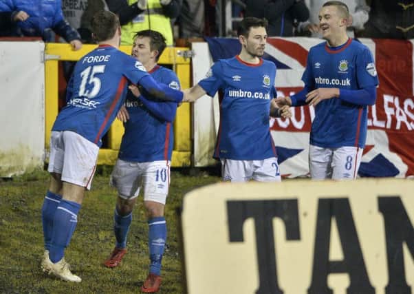 Jordan Stewart and his Linfield team-mates celebrate a late goal against Portadown. Pic by INPHO.