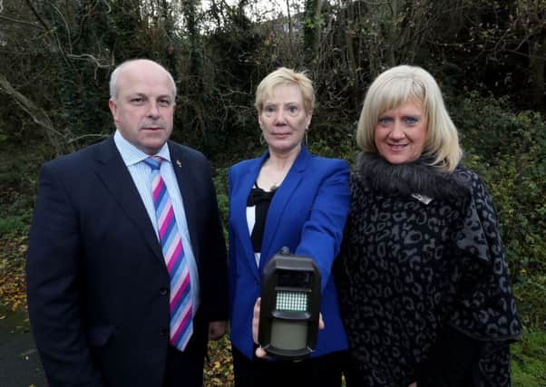 Pictured with one of the CCTV cameras used by Lisburn & Castlereagh City Council to catch flytippers are: (l-r) Alderman James Tinsley, Vice-Chair of the Council's Environmental Services Committee; Councillor Janet Gray MBE, Vice-Chair of the Council's Environmental Services Committee and Heather Moore, Director of Environmental Services.