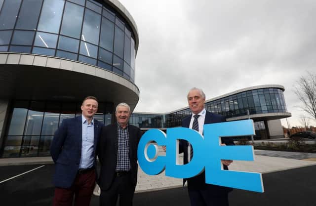 Pictured marking the hand-over of the development are Tony Convery, right, Chairman of CDE  Jason Arthur left, from architects and engineers Teague and Sally, and Liam Murphy, cemtre, from building contractor Felix OÃ¢Â¬"Hare. CDE will now put in place the finishing touches to the impressive facility, including erecting signage, before beginning to move equipment and staff into the building in the months ahead.