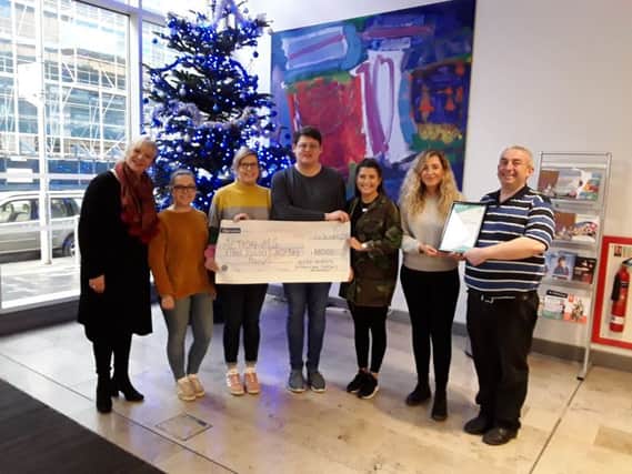 Pictured receiving the cheque Gerry Mitchell (AMS) with Rachel Harrison and James Gibson along with their fellow students.