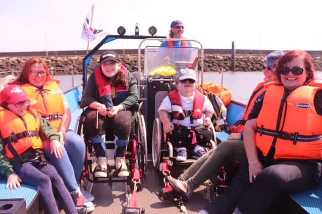Staff and students of Mitchell House enjoying a day on the water at Belfast Lough Sailability.