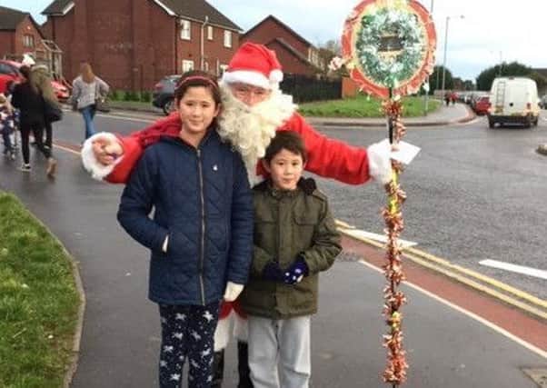 Naomi and Jeremy met Santa on their way to school.