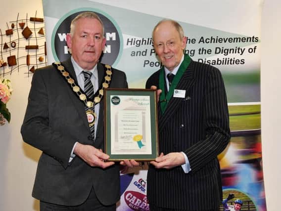 Chair of Mid Ulster District Council, Councillor Sean McPeake receives the William Keown Award Trust Access Award from Mr Trevor Taylor, Deputy President of The William Keown Trust.
