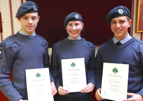 Cadet Jayden Martlew (14), Cadet Sergeant Catherine Hill (16) and Cadet Aaron Thompson (15), Larne Squadron Air Training Corps, show off their certificates marking participation in the research challenge.