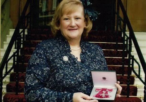 Former RUC officer Joyce Crossan with the MBE she was awarded in 2009