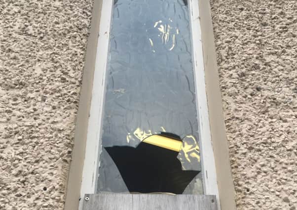A window that had been smashed at Ballyclare Free Presbyterian Church, on the last weekend of 2018.