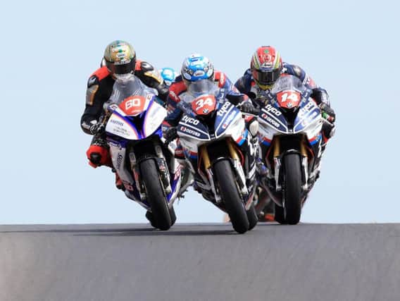 Alastair Seeley, Peter Hickman and Dan Kneen in action in the second Superstock race at the 2018 North West 200.