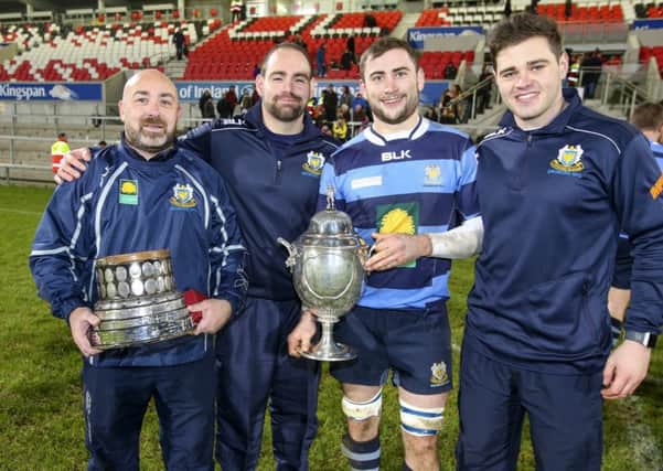 The winning Dromore Coaches Jeremy Ogle, Jonny Cullen and James Kirk with captain Adam McGregor with the  2019 MMW Ulster Junior Cup after the Final victory over Ballynahinch II