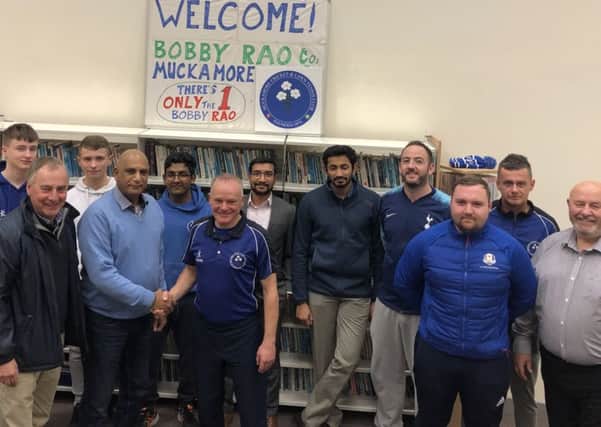Bobby Rao is welcomed to Muckamore by members of the first team squad and first team manager Ivan McCombe, right