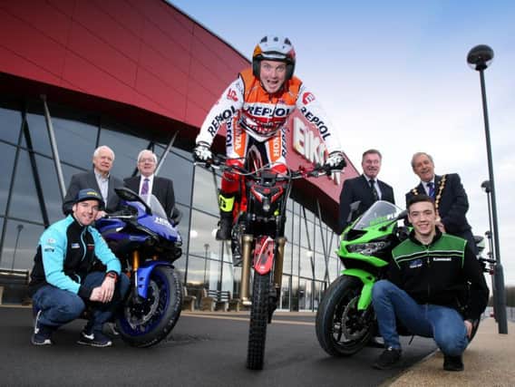 Ulster trials champion Andrew Perry helped launch the Black Horse Northern Ireland Motorcycle Festival at the Eikon Exhibition centre. Looking on are race stars Alastair Seeley and Eunan McGlinchey, show promoter Billy Nutt,  Mayor Uel Mackin and Alderman Allan Ewart of Lisburn and Castlereagh Council, and Alan Crowe of the Royal Ulster Agricultural Society.