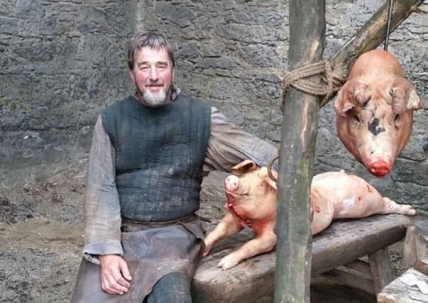 Kenny with two sows he bred to look iron age for Game of Thrones