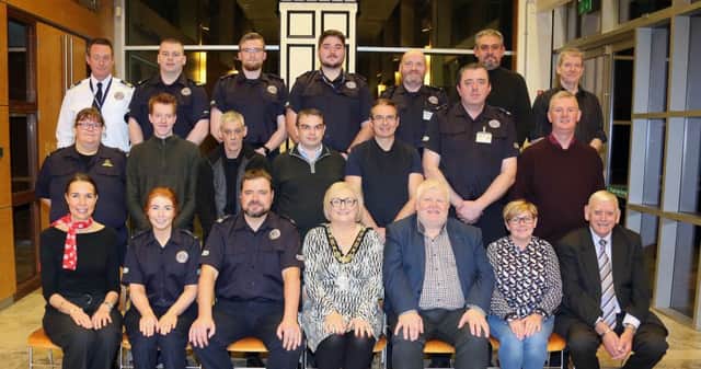 The Mayor of Causeway Coast and Glens Borough Council, Councillor Brenda Chivers pictured with Community Rescue Service volunteers, Regional Commander Sean Mc Carry and elected members from Causeway Coast and Glens Borough Council at a civic reception in Cloonavin.