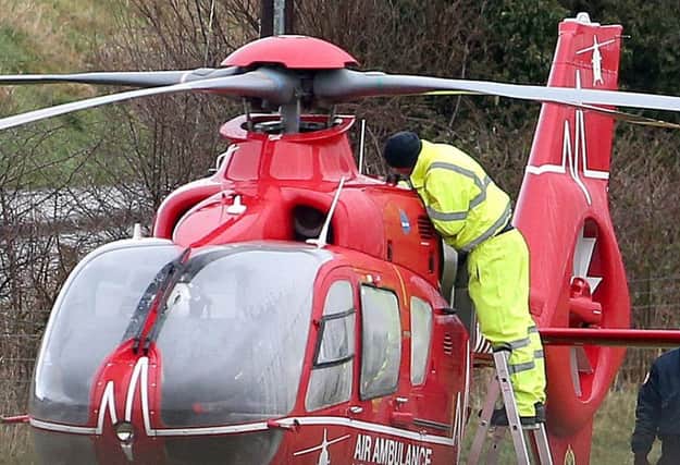An engineer working to fix a fault on the air ambulance. Pic: Steven McAuley/McAuley Multimedia