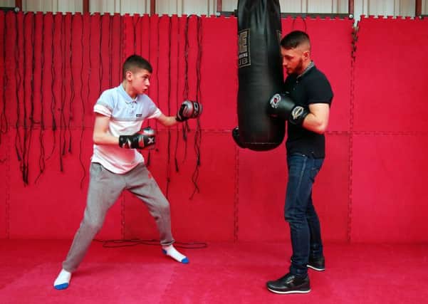 Boxer Ryan Burnett puts William through his paces on a visit to the National Lottery funded Oasis Caring in Action project in Antrim as part of a campaign to thank National Lottery players for helping support projects in Northern Ireland.
Pic credit: Jonathan Porter/Presseye