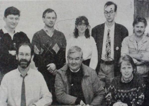 Andy McAvoy (seated left) manager of Carrick Business Complex, with local people who attended a training course at Kilroot Park. 1989