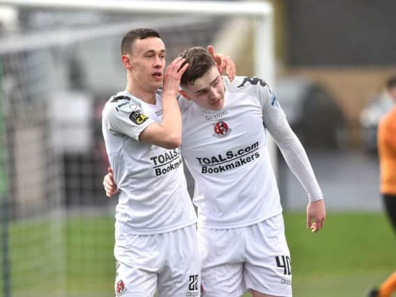 Crusaders' Paul Heatley celebrates with Ronan Hale, after the striker scored at the Brandywell.