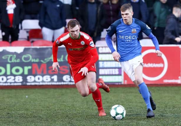 Cliftonville's Ross Lavery and Rhys Marshall of Glenavon. Mandatory Credit ©INPHO/Philip Magowan