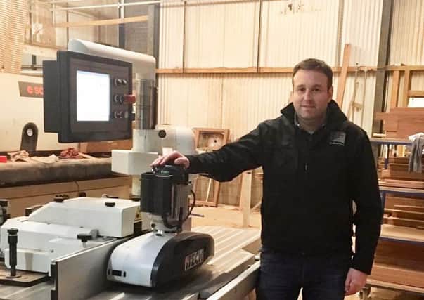 Colin Millar (Millar Woodcraft Specialist Joinery Manufacture Ltd) beside one of the machines funded with assistance from the Rural Development Programme.