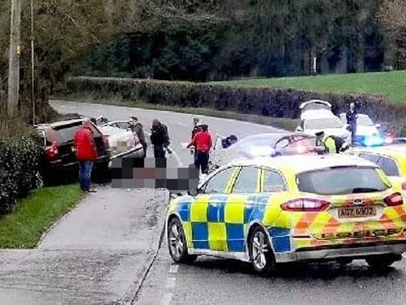 Police at the scene of Sunday's crash in which three people lost their lives
