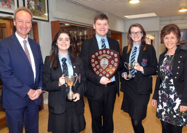 The Portadown College debating team were winners in the Northern Ireland Business and Professional Women's Debating competition for the third year in a row. In addition Joanna Kerr was awarded the prize for best chairperson and Danielle Weir received the prize for best expresser of thanks. pictured from left are Mr Simon Harper, school principal, team members, Joanna Kerr, Josh Quinn and Danielle Weir andMrs Gladys Montgomery, head of English. INPT07-201.