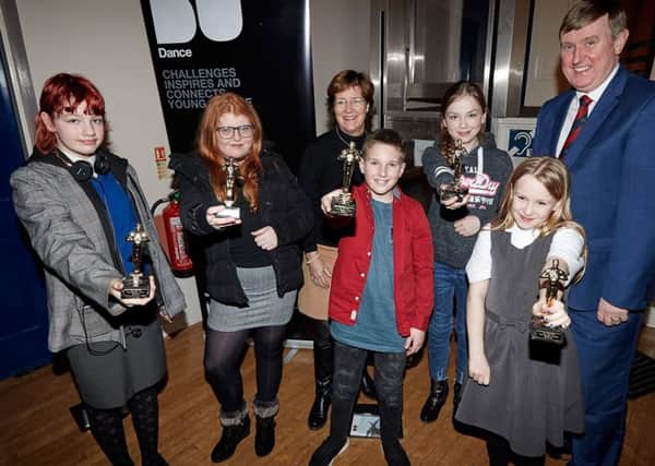 Terry Burns (BBC Children in Need - centre back row) and Mervyn Storey MLA (back right) with performers from 'The People I know' with their awards at the showing of 'The People I Know' at Ballymoney Town Hall, 29th January 2019.