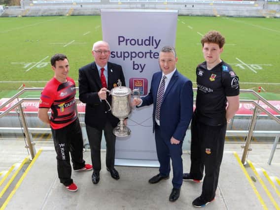 Harry Doyle from Ctiy of Armagh with Matthew Norris of Ballymena ahead of the First Trust Senior Cup final bieng played at Kingspan Stadium. Included are Ulster Branch president, Stephen Elliott and First Trust's James Beattie