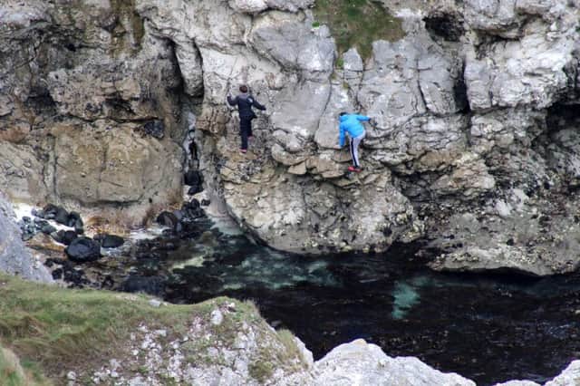 Youths scaling cliffs unaided without any safety equipment  at Kenbane near Ballycastle at the weekend.  PICTURE KEVIN MCAULEY/MCAULEY MULTIMEDIA