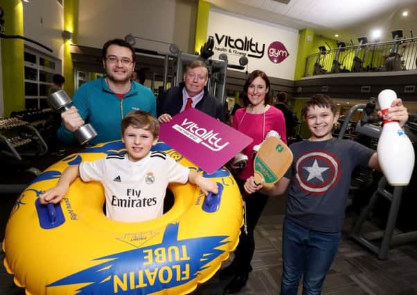 The Chairman of the Leisure & Community Development Committee, Alderman Paul Porter is joined by a local family to launch the new Vitality Membership Package available at six Sports Services facilities across Lisburn & Castlereagh
