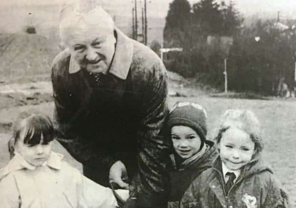 Banbridge Councillor Archie McKelvey cuts the first sod for the new school at Kinallen in 1996 with help from Melanie Barlow, Debbie Johnston and Andrew McCammon.