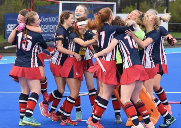 Rachel Hill is mobbed by her Ballyclare team mates after scoring the vital goal