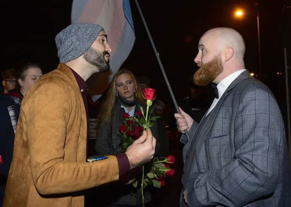 Ex-gay Matthew Grech offers a Valentines rose to LGBT protestor John ODoherty before last nights screening.
Photo: Pacemaker: Arthur Allison.