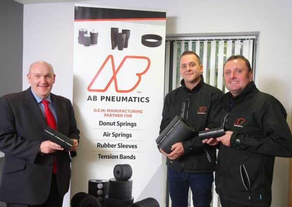Alderman William Leathem, Chairman of the Council's Development Committee views some of the products AB Pneumatics make for Dunlop Systems & Components with Peter Blair and Jonny Boomer, co-owners of AB Pneumatics .