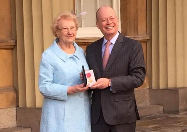 Norman Houston with his aunt Helen Crawford outside Buckingham Palace after receiving his OBE.