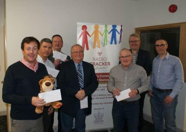 Pictured at the Radio Cracker cheque presentations night are - Colin Davies (Spud Bears), Norman Kennedy (Bread), Wesley Kerr (Lifeline Ministries), Rev Tom Robinson (Kids4School), Jimmy Hamill (Care for Cambodia), Trevor Magee (E3 Initiative) and Neil Jordan (Radio Cracker).
Radio Crackers fundraising has already started for another year with their New and Nearly-New sale running until Saturday, March 16, at 20 Greenvale Street.