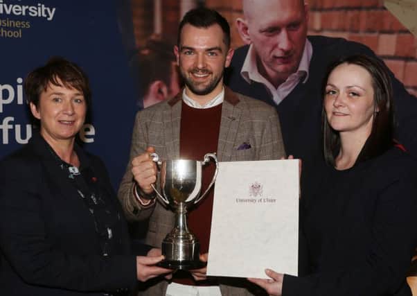 Thomas Sinton is presented with his award by Ciara McKinless, HR Manager and Olga Henry, general manager from sponsors Da Vincis Hotel.