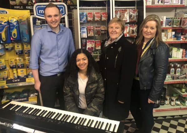 Shoppers to Woodsides Pharmacy were in for a treat during Midtown Sounds as Jedidah Shanks performed in store on Saturday.Pictured is Woodsides Pharmacist, Seamus Killough; Jedidah Shanks; Cllr Audrey Wales MBE and BID Manager, Kathleen McBride.