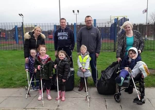 Cllr Foster pictured with volunteers at the clean up event.