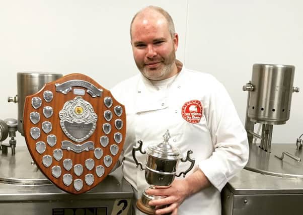 Ross Hawkins, who runs The Rinkha ice cream parlour in Islandmagee, with the silver challenge cup in the open flavour class and the shield for best of the best flavour, in the National Ice Cream Competition.