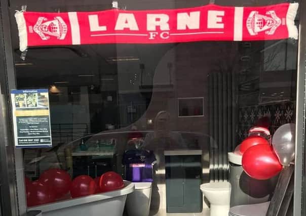 The Larne FC window display at Prestige Flooring and Bathrooms. Pic by Ellis Cahoon.