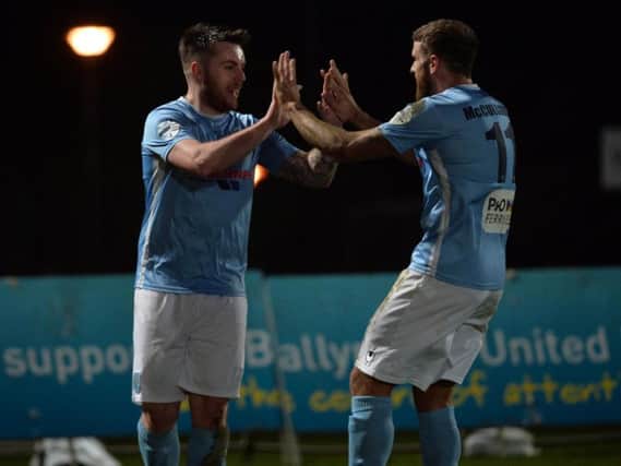 United's Cathair Friel and Steven McCullough celebrate after taking the lead