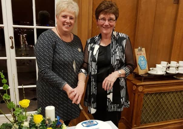 Gleno WI member Shirley Kernohan baked and decorated a special 70th Anniversary cake which was cut by President Valerie Moore and Vice President Joan Arnold, pictured.
